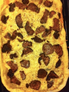 Pizza with olive-pistachio tapenade and breaded eggplant and mushrooms